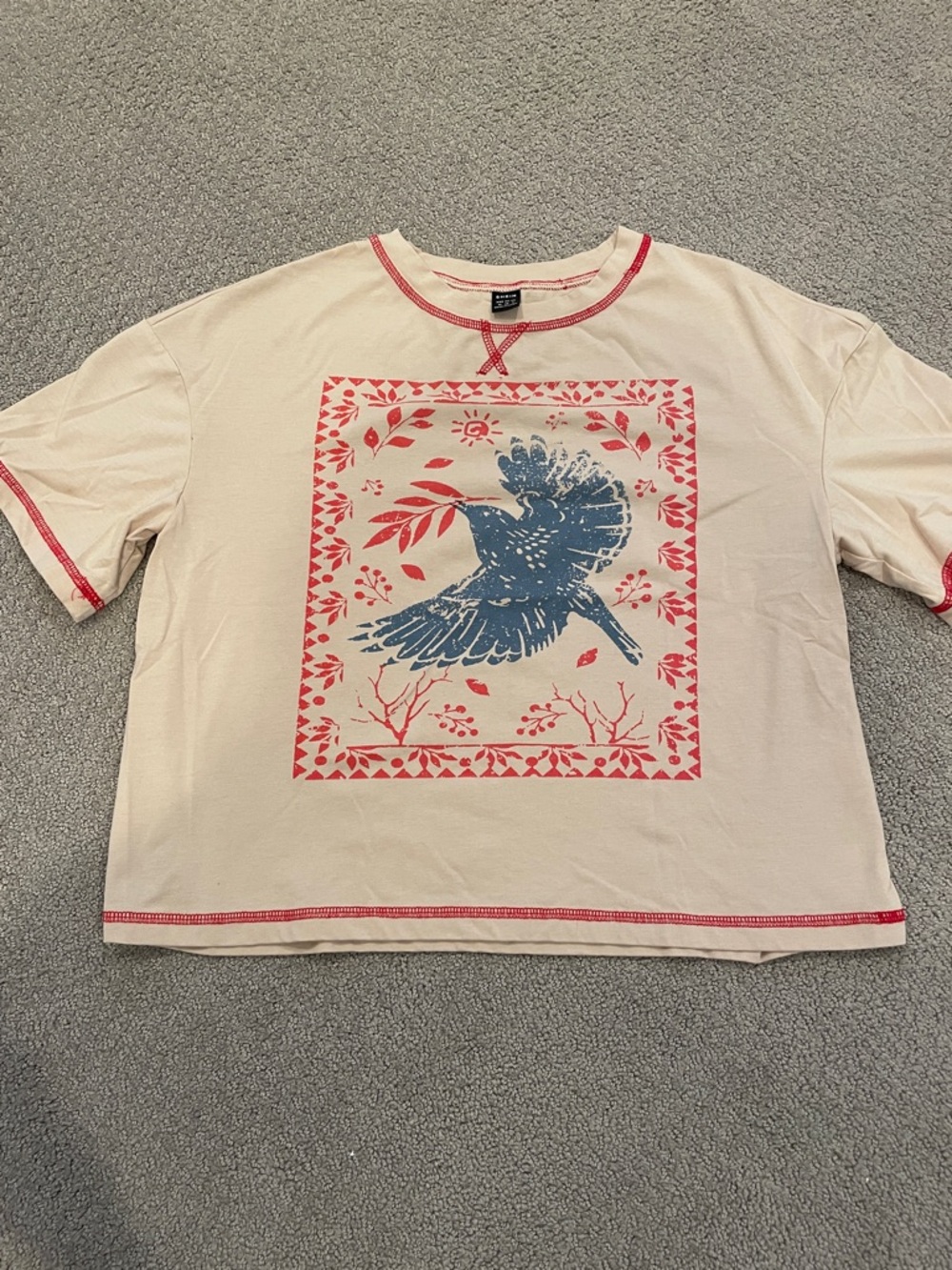 Graphic Tee with Blue Bird and Red Accents